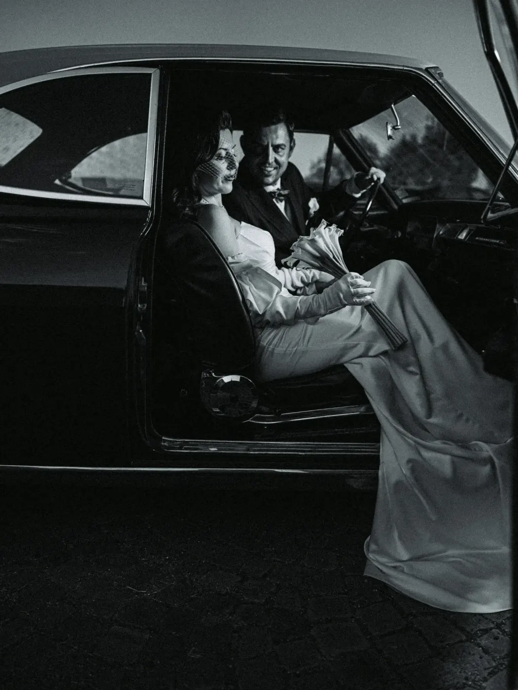 Newlyweds in a vintage car