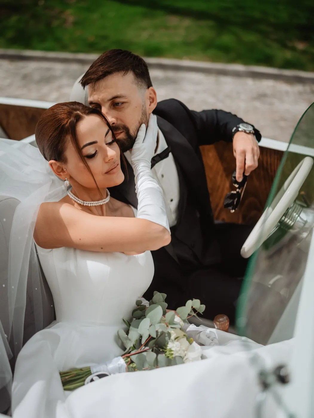 Newlyweds on the rocks by the sea